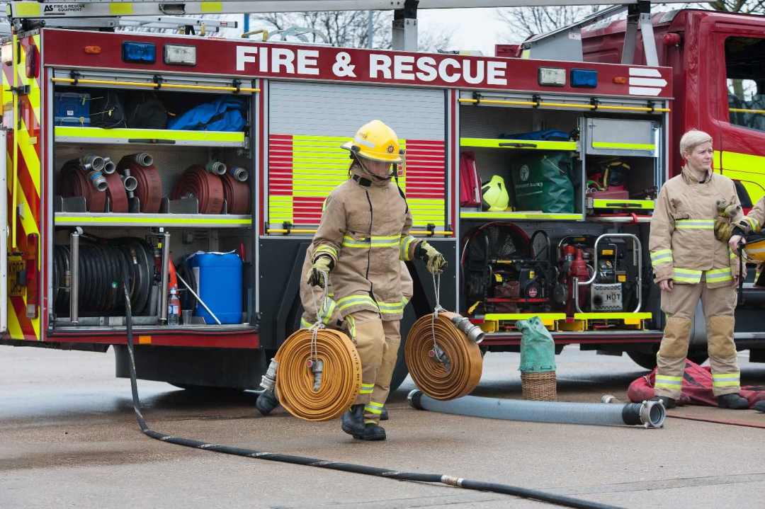 Learning how to carry heavy fire hoses at a Beds Fire Open Day. Image: Bedfordshire Fire and Rescue Service
